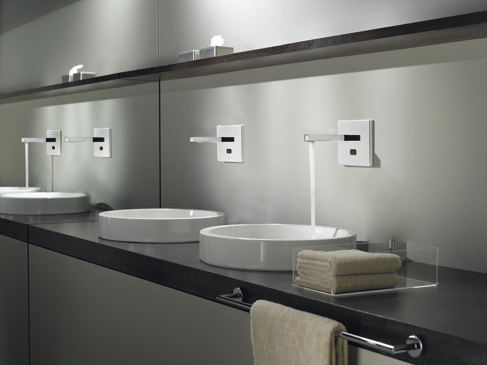 Collection of commercial touchless sensor faucets in multiple finishes
